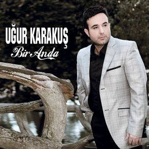 Download track Bir Anda Uğur Karakuş